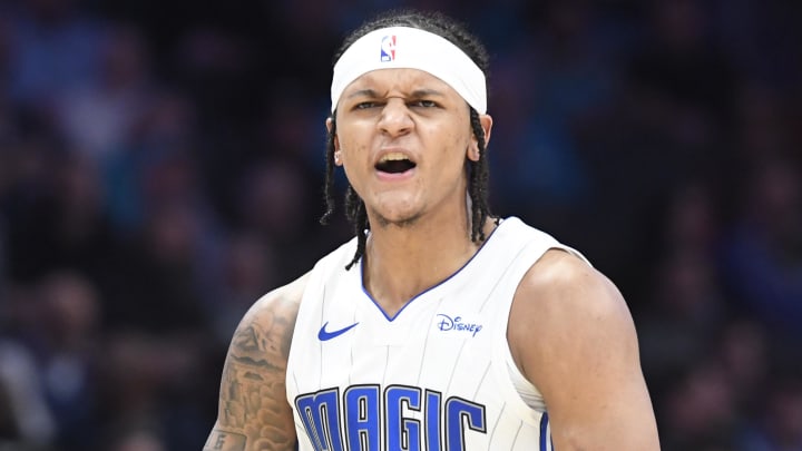 Mar 5, 2024; Charlotte, North Carolina, USA;  Orlando Magic forward Paolo Banchero (5) reacts after scoring during the second half against the Charlotte Hornets at the Spectrum Center. Mandatory Credit: Sam Sharpe-USA TODAY Sports
