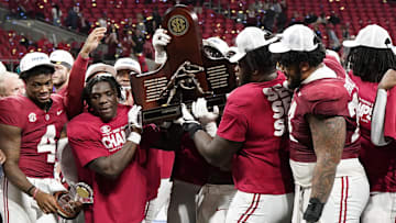 Dec 2, 2023; Atlanta, GA, USA; The Alabama Crimson Tide react after defeating the Georgia Bulldogs for the SEC Championship at Mercedes-Benz Stadium. Mandatory Credit: Dale Zanine-Imagn Images