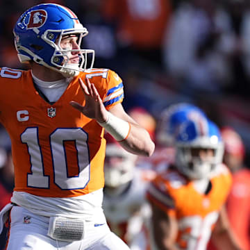 Jan 5, 2025; Denver, Colorado, USA; Denver Broncos quarterback Bo Nix (10) throws a pass in the first quarter against the Kansas City Chiefs at Empower Field at Mile High.