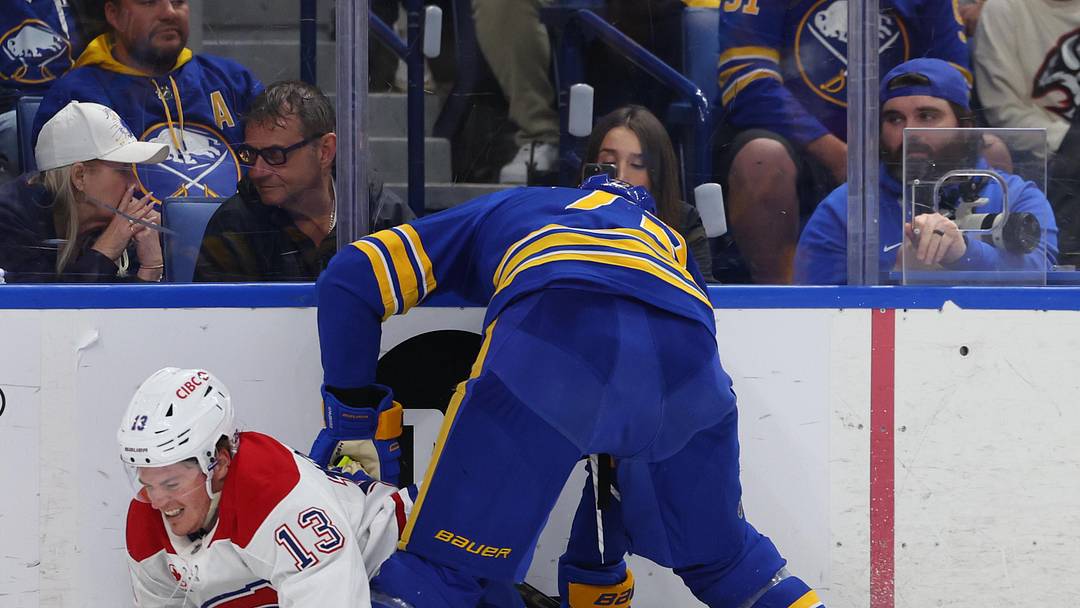 May 6, 2026; Buffalo, New York, USA; Buffalo Sabres center Tage Thompson (72) checks Montréal Canadiens right wing Cole Caufield (13) as he goes after a loose puck during the third period in game one of the second round of the 2026 Stanley Cup Playoffs at KeyBank Center. Mandatory Credit: Timothy T. Ludwig-Imagn Images