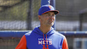 Mar 13, 2022; Port St. Lucie, FL, USA; New York Mets hitting coach Eric Chavez looks on as players take batting practice during spring training. Mandatory Credit: Sam Navarro-Imagn Images