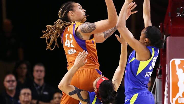 Aug. 21, 2018; Tempe, AZ, USA; Phoenix Mercury center Brittney Griner puts up a shot over Dallas Wings guard Allisha Gray (15) in the first half during round one of the WNBA Playoffs at Wells Fargo Arena. Mandatory Credit: Rob Schumacher/The Republic via USA TODAY NETWORK