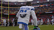 Detroit Lions cornerback Amik Robertson (21) kneels on the field during warmups prior to a game against Commanders