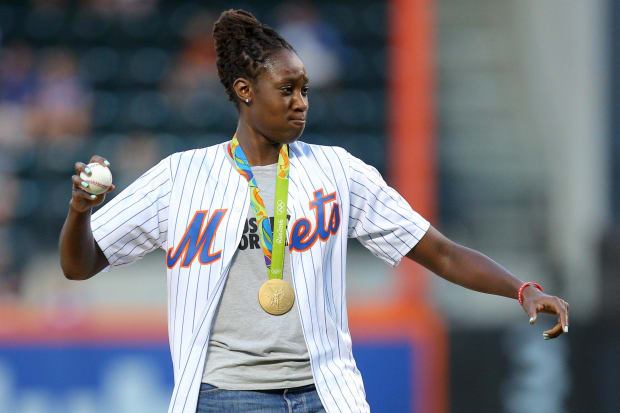 Charles throws the first pitch at a New York Mets game