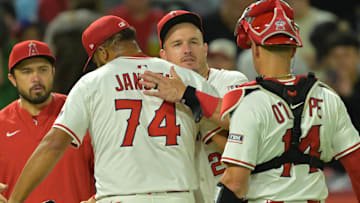 Angels relief pitcher Kenley Jansen (74) is congratulated by designated hitter Mike Trout (27) after earning a save in the ninth inning defeating the Texas Rangers at Angel Stadium on July 28.