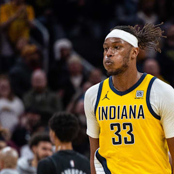 Mar 20, 2025; Indianapolis, Indiana, USA; Indiana Pacers center Myles Turner (33) celebrates the game winning block in the game against the Brooklyn Nets at Gainbridge Fieldhouse. Mandatory Credit: Trevor Ruszkowski-Imagn Images