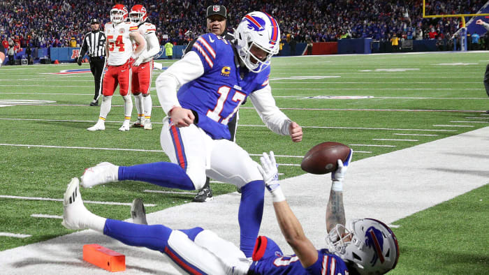 Buffalo Bills quarterback Josh Allen (17) jumps in to celebrate with Buffalo Bills wide receiver