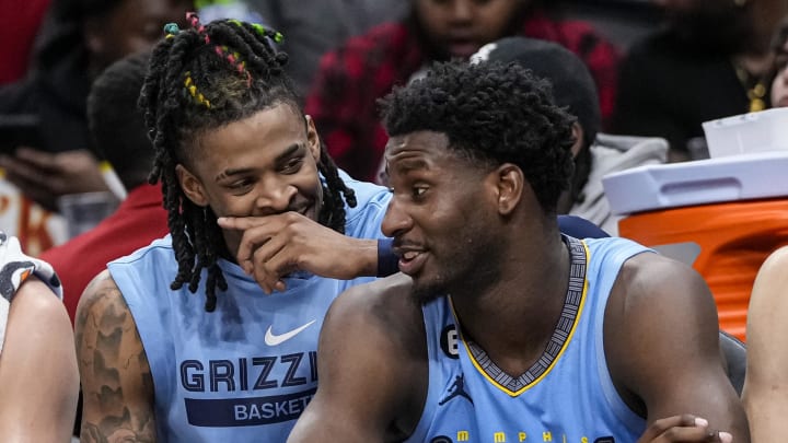 Mar 26, 2023; Atlanta, Georgia, USA; Memphis Grizzlies guard Ja Morant (12) and forward Jaren Jackson Jr. (13) react ons the bench during the game against the Atlanta Hawks during the second half at State Farm Arena. Mandatory Credit: Dale Zanine-USA TODAY Sports