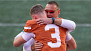 Texas Longhorns head coach Steve Sarkisian hugs Texas Longhorns quarterback Quinn Ewers during senior day