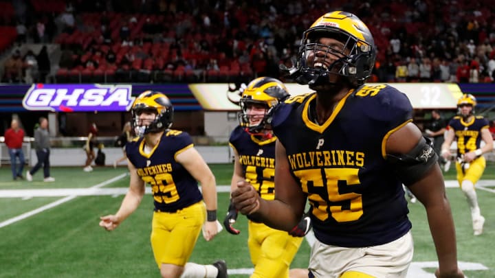 Prince Avenue's Christian Garrett (55) celebrates after winning the GHSA high school football Class A-Division 1 championship game against Swainsboro at Mercedes-Benz Stadium in Atlanta, on Monday, Dec. 11, 2023. Prince Avenue won 49-32.