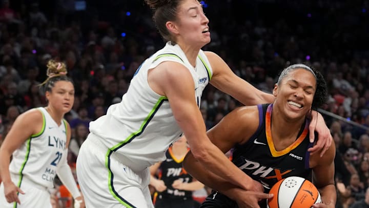 Phoenix Mercury forward Alyssa Thomas (25) is fouled by Minnesota Lynx forward Jessica Shepard (15) during their WNBA semifinal playoff game at PHX Arena on Sept. 28, 2025.