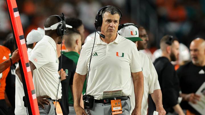 Nov 15, 2025; Miami Gardens, Florida, USA; Miami Hurricanes head coach Mario Cristobal watches from the sideline against NC State Wolfpack during the fourth quarter at Hard Rock Stadium. Mandatory Credit: Sam Navarro-Imagn Images