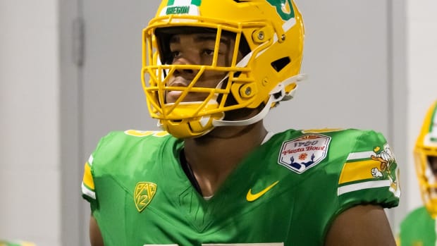 Jan 1, 2024; Glendale, AZ, USA; Oregon Ducks offensive lineman Ajani Cornelius (65) against the Liberty Flames during the 202