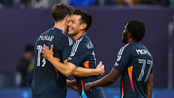 May 3, 2025; San Diego, California, USA; San Diego FC midfielder Hirving Lozano (11) celebrates with defender Paddy McNair (17) after scoring during the first half against FC Dallas at Snapdragon Stadium. Mandatory Credit: Chadd Cady-Imagn Images