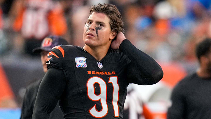 Cincinnati Bengals defensive end Trey Hendrickson (91) watches a replay as the Detroit Lions celebrate a touchdown in the fourth quarter of the NFL Week 5 game between the Cincinnati Bengals and the Detroit Lions at Paycor Stadium in downtown Cincinnati on Sunday, Oct. 5, 2025. The Bengals continued a losing streak, falling 37-24 to the Lions.