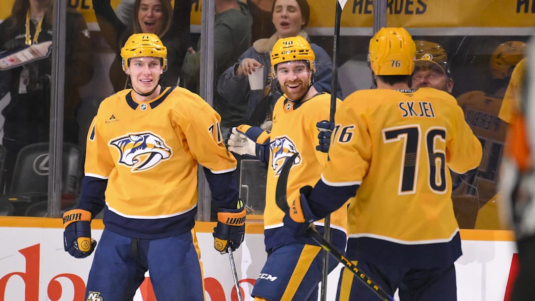 Nashville Predators right wing Matthew Wood (71) celebrates with his teammates after scoring a goal against the Boston Bruins Mar 5, 2026; Nashville, Tennessee, USA;  during the second period at Bridgestone Arena. Mandatory Credit: Steve Roberts-Imagn Images