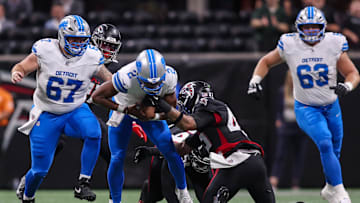 Detroit Lions quarterback Hendon Hooker (2) is stripped by Atlanta Falcons linebacker Josh Woods (42). Mandatory Credit: Brett Davis-Imagn Images