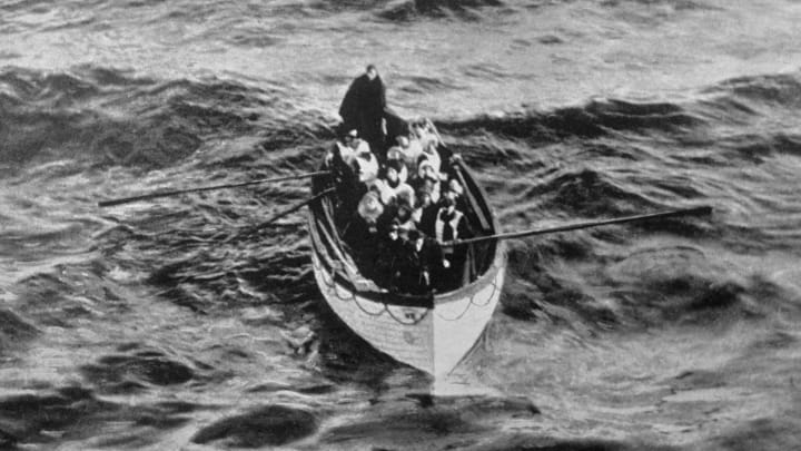 ‘Titanic’ survivors in a lifeboat row toward rescue after the ocean liner sank in 1912.
