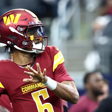 Oct 19, 2025; Arlington, Texas, USA; Washington Commanders quarterback Jayden Daniels (5) warms up prior to the game against the Dallas Cowboys at AT&T Stadium. Mandatory Credit: Kevin Jairaj-Imagn Images