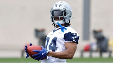 Jun 10, 2025; Arlington, TX, USA; Dallas Cowboys running back Jaydon Blue (34) goes through a drill during practice at the Ford Center at the Star Training Facility in Frisco, Texas. Mandatory Credit: Chris Jones-Imagn Images