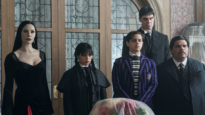 Catherine Zeta-Jones as Morticia Addams, Jenna Ortega as Wednesday Addams, Isaac Ordonez as Pugsley Addams, Joonas Suotamo as Lurch, Luis Guzmán as Gomez Addams in episode 201 of Wednesday