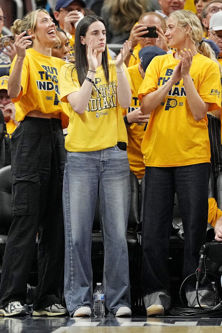 Indiana Fever player Caitlin Clark celebrates from the crowd during the 2025 NBA Finals between the Pacers and Oklahoma City 