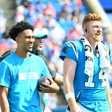 Aug 24, 2024; Orchard Park, New York, USA; Carolina Panthers quarterback Bryce Young and quarterback Andy Dalton (14) react to their team scoring a touchdown against the Buffalo Bills in the third quarter pre-season game at Highmark Stadium.