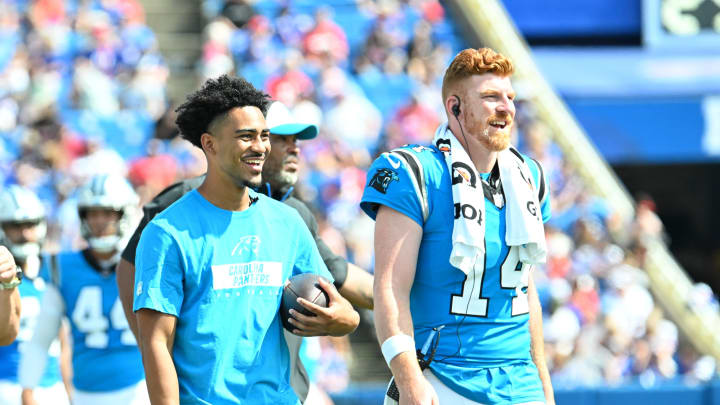 Aug 24, 2024; Orchard Park, New York, USA; Carolina Panthers quarterback Bryce Young and quarterback Andy Dalton (14) react to their team scoring a touchdown against the Buffalo Bills in the third quarter pre-season game at Highmark Stadium.