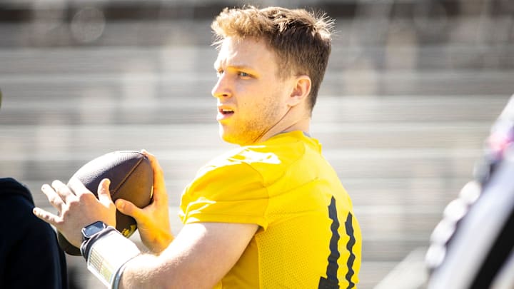 Apr 26, 2025; Iowa City, IA, USA; Iowa quarterback Mark Gronowski (11) throws during a spring NCAA football open practice at Kinnick Stadium. Mandatory Credit: Joseph Cress/For the Register