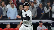 Oct 2, 2025; Bronx, New York, USA; New York Yankees outfielder Cody Bellinger (35) runs to home plate in the fourth inning against the Boston Red Sox during game three of the Wildcard round for the 2025 MLB playoffs at Yankee Stadium. Mandatory Credit: Vincent Carchietta-Imagn Images