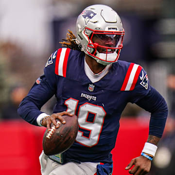 Jan 5, 2025; Foxborough, Massachusetts, USA; New England Patriots quarterback Joe Milton III (19) runs the ball against the Buffalo Bills in the first half at Gillette Stadium. Mandatory Credit: David Butler II-Imagn Images