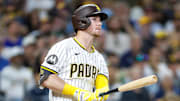 Sep 23, 2025; San Diego, California, USA; San Diego Padres first baseman Ryan O'Hearn (32) hits a grand slam during the first inning against the Milwaukee Brewers at Petco Park. Mandatory Credit: David Frerker-Imagn Images