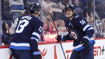 Nov 3, 2024; Winnipeg, Manitoba, CAN; Winnipeg Jets center Mark Scheifele (55) celebrates his second period goal with Winnipeg Jets center Gabriel Vilardi (13) against the Tampa Bay Lightning at Canada Life Centre. Mandatory Credit: James Carey Lauder-Imagn Images