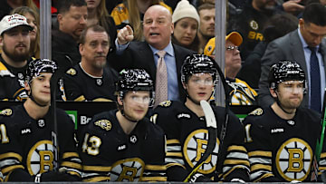 Boston Bruins head coach Jim Montgomery directs his players during the third period against the Winnipeg Jets at TD Garden. 