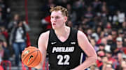 Jan 2, 2025; Spokane, Washington, USA; Portland Pilots forward Austin Rapp (22) controls the ball against the Gonzaga Bulldogs in the first half at McCarthey Athletic Center. Mandatory Credit: James Snook-Imagn Images
