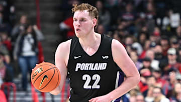 Jan 2, 2025; Spokane, Washington, USA; Portland Pilots forward Austin Rapp (22) controls the ball against the Gonzaga Bulldogs in the first half at McCarthey Athletic Center. Mandatory Credit: James Snook-Imagn Images