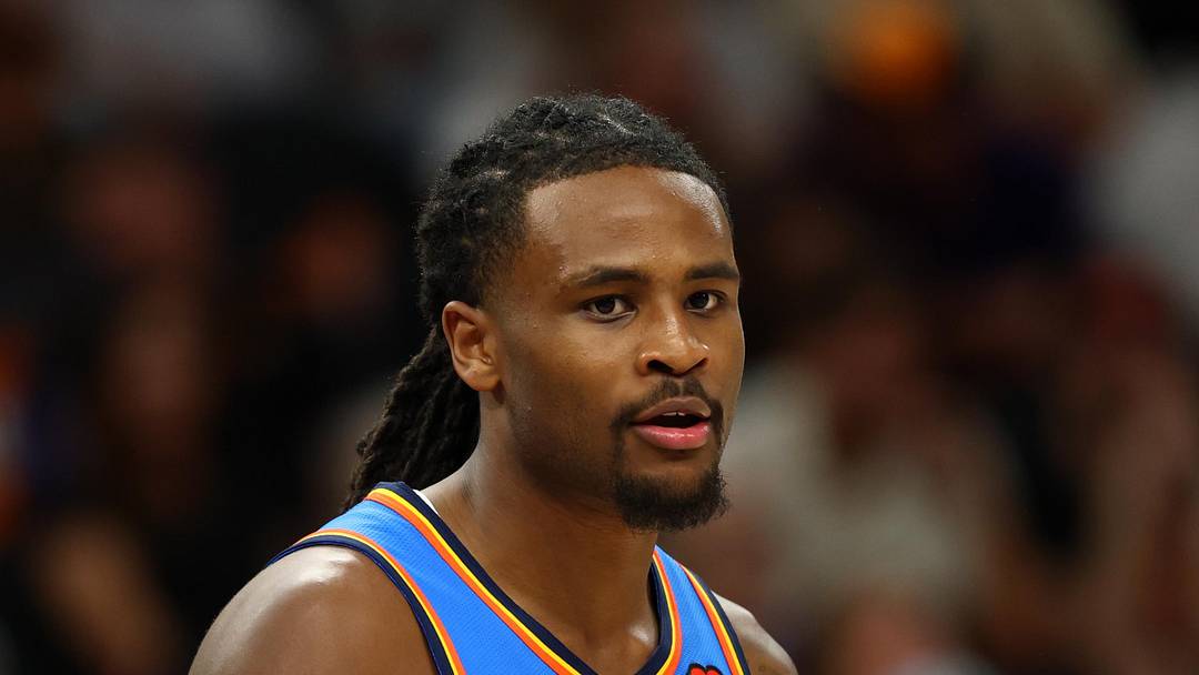 Apr 27, 2026; Phoenix, Arizona, USA; Oklahoma City Thunder guard Cason Wallace (22) against the Phoenix Suns during game four of the first round of the 2026 NBA Playoffs at Mortgage Matchup Center. Mandatory Credit: Mark J. Rebilas-Imagn Images