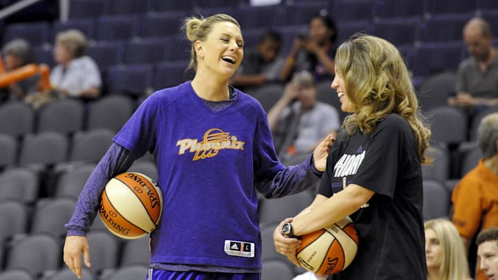 May 27, 2013; Phoenix, AZ, USA; Phoenix Mercury forward Penny Taylor (13) and assistant coach Julie Hairgrove laugh during warm ups before tip off against the Chicago Sky at US Airways Center. Mandatory Credit: Casey Sapio-Imagn Images