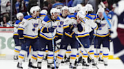 Mar 29, 2025; Denver, Colorado, USA; Members of the St. Louis Blues celebrate defeating the Colorado Avalanche at Ball Arena. Mandatory Credit: Ron Chenoy-Imagn Images