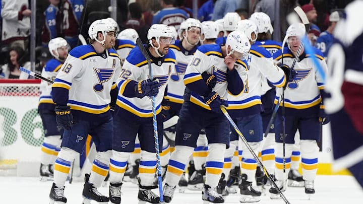 Mar 29, 2025; Denver, Colorado, USA; Members of the St. Louis Blues celebrate defeating the Colorado Avalanche at Ball Arena. Mandatory Credit: Ron Chenoy-Imagn Images