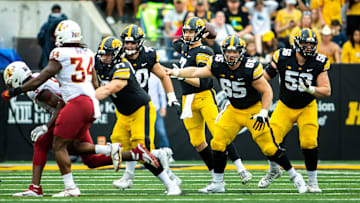 Iowa quarterback Spencer Petras (7) throws a pass as Connor Colby (77) center Logan Jones (65) and Michael Myslinski (53) block during a NCAA football game against Iowa State, Saturday, Sept. 10, 2022, at Kinnick Stadium in Iowa City, Iowa.

220910 Isu Iowa Fb 050 Jpg