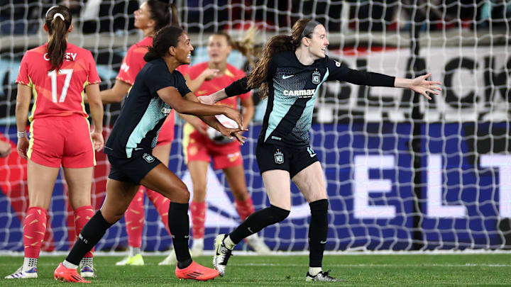 Rose Lavelle (right) celebrates with midfielder Yazmeen Ryan (left) after scoring the winning goal against Portland Thorns in the 2024 NWSL Playoffs. 
