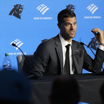 Feb 1, 2024; Charlotte, NC, USA; Carolina Panthers head coach Dave Canales speaks to the media as general manager Dan Morgan looks on during the introductory press conference at Bank of America Stadium