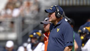 Oct 18, 2025; Orlando, Florida, USA;  West Virginia Mountaineers head coach Rich Rodriguez watches a play during the first half against the Central Florida Knights at Acrisure Bounce House. Mandatory Credit: Russell Lansford-Imagn Images