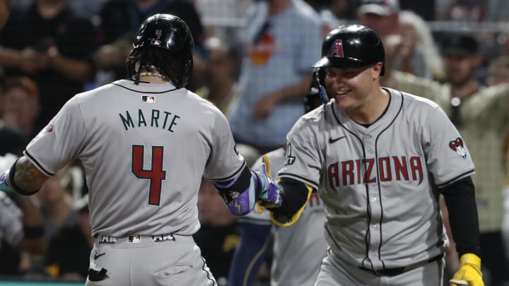 Aug 2, 2024; Pittsburgh, Pennsylvania, USA;  Arizona Diamondbacks designated hitter Joc Pederson (3) reacts to second baseman Ketel Marte (4) crossing home plate  with his second solo home run of the game against the Pittsburgh Pirates during the ninth inning at PNC Park. Arizona won 9-8. Mandatory Credit: Charles LeClaire-USA TODAY Sports