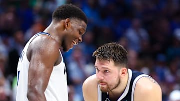 May 28, 2024; Dallas, Texas, USA; Minnesota Timberwolves guard Anthony Edwards (5) speaks to Dallas Mavericks guard Luka Doncic (77) during the fourth quarter during game four of the western conference finals for the 2024 NBA playoffs at American Airlines Center. Mandatory Credit: Kevin Jairaj-Imagn Images