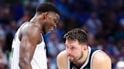 May 28, 2024; Dallas, Texas, USA; Minnesota Timberwolves guard Anthony Edwards (5) speaks to Dallas Mavericks guard Luka Doncic (77) during the fourth quarter during game four of the western conference finals for the 2024 NBA playoffs at American Airlines Center. Mandatory Credit: Kevin Jairaj-Imagn Images