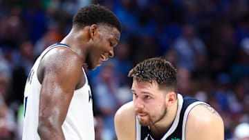 May 28, 2024; Dallas, Texas, USA; Minnesota Timberwolves guard Anthony Edwards (5) speaks to Dallas Mavericks guard Luka Doncic (77) during the fourth quarter during game four of the western conference finals for the 2024 NBA playoffs at American Airlines Center. Mandatory Credit: Kevin Jairaj-Imagn Images