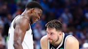 May 28, 2024; Dallas, Texas, USA; Minnesota Timberwolves guard Anthony Edwards (5) speaks to Dallas Mavericks guard Luka Doncic (77) during the fourth quarter during game four of the western conference finals for the 2024 NBA playoffs at American Airlines Center. Mandatory Credit: Kevin Jairaj-Imagn Images