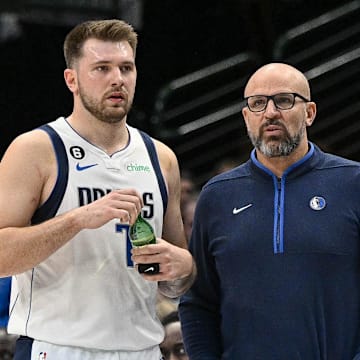 Jan 7, 2023; Dallas, Texas, USA; Dallas Mavericks guard Luka Doncic (77) talks with head coach Jason Kidd during the first quarter of the game against the New Orleans Pelicans at the American Airlines Center. Mandatory Credit: Jerome Miron-Imagn Images